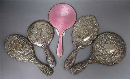 Five assorted silver mounted hand mirrors including pink guilloche enamel and Reynolds Angels.